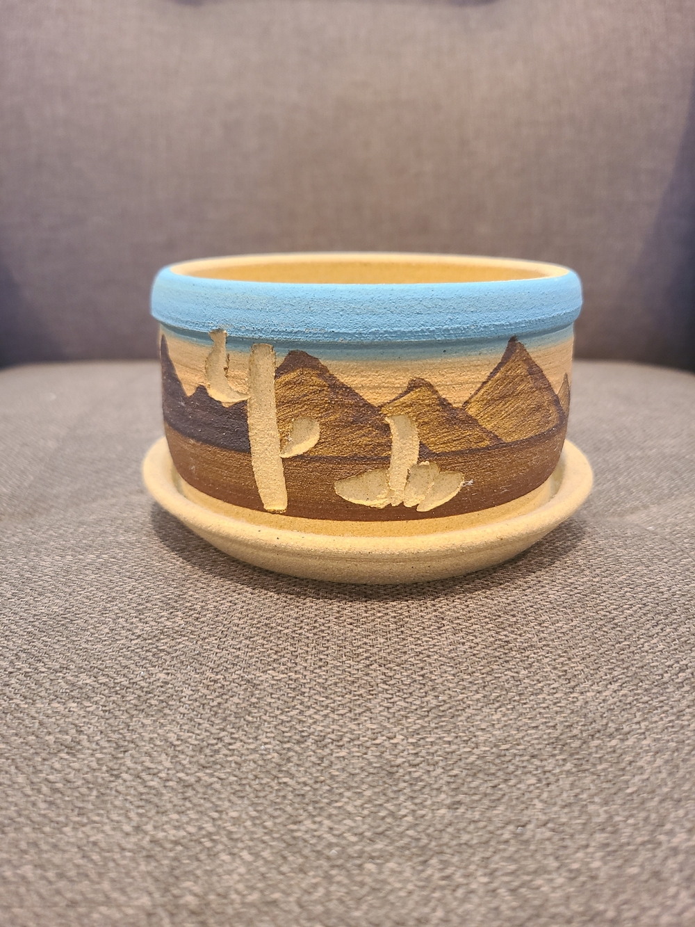 Vintage Southwestern-style ceramic planter featuring an etched desert landscape